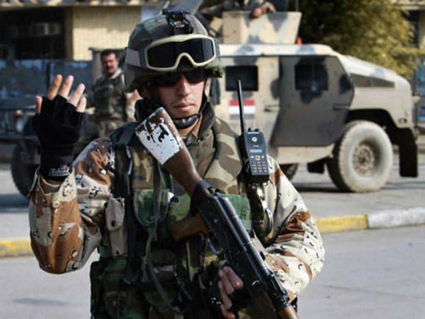An Iraqi army soldier mans a checkpoint in central Baghdad, January 11, 2006. 