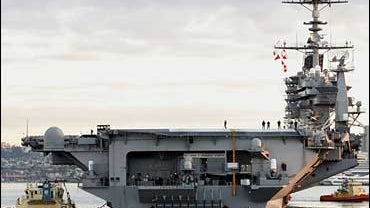 The USS John C. Stennis leaves Naval Air Station North Island in Coronado, Calif. Saturday, Jan. 20, 2007, on a deployment to the Persian Gulf. 