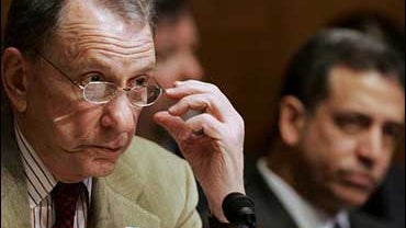 Sen. Arlen Specter, R-Pa., left, and Sen. Russ Feingold, D-Wis., listen to testimony on Congress' constitutional power to end a war, Tuesday, Jan. 30, 2007 on Capitol Hill. 
