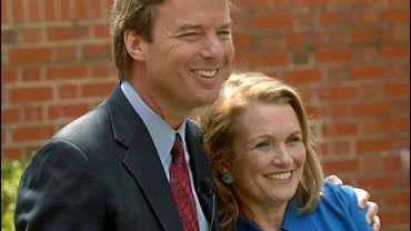 Democratic Presidential candidate John Edwards and his wife Elizabeth Edwards talk to the media about the return of her cancer during a news conference March 22, 2007 in Chapel Hill, North Carolina. 