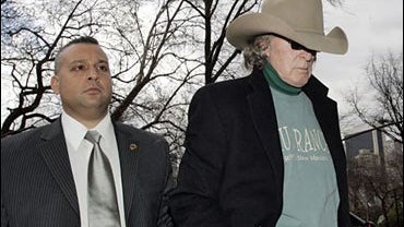 Radio host Don Imus, right, arrives at his residence in New York Friday, April 13, 2007. 