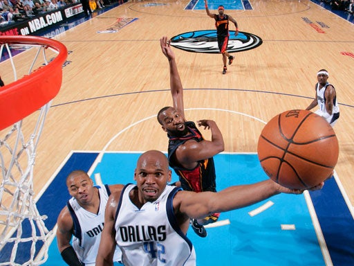 Jerry Stackhouse (42) of the Dallas Mavericks goes in for the layup past Baron Davis (5) of the Golden State Warriors in Game Two of the Western Conference Quarterfinals during the 2007 NBA Playoffs on April 25, 2007 at the American Airlines Center in Dal 