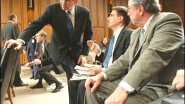 Paul Wolfowitz, Kevin Kellems, and Powell Moore 