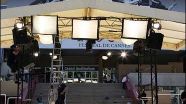 People pass by the Festival Palace prior to the start of the 60th International film festival in Cannes, southern France, on Tuesday, May 15, 2007. The festival opens Wednesday night with the premiere of "Blueberry Nights." (Photo: AP Photo/Lionel Cironne 