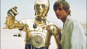 C-3PO and Luke Skywalker of "Star Wars" 