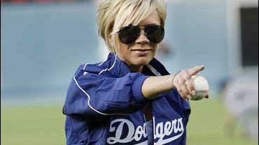 Victoria Beckham prepares to throw out the ceremonial first pitch before a baseball game between the New York Mets and the Los Angeles Dodgers in Los Angeles, Monday, June 11, 2007. 
