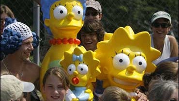 Springfield, Vt. residents shoot a scene with Marge Simpson and Lisa Simpson props in Springfield, Vt., Tuesday, June 19, 2007. Springfield likes to think itself a real-life alter ego to the home of "The Simpsons." Now, the town is going all out to prove  