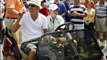 Kid Rock rides in a cart during the final round of the Buick Open golf tournament at Warwick Hills in Grand Blanc, Mich., Sunday, July 1, 2007. 
