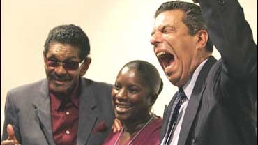 Gloria Lowe poses with Carl Gardner (the Coasters) and Jon Bauman ("Bowzer" of the vocal group Sha Na Na) 