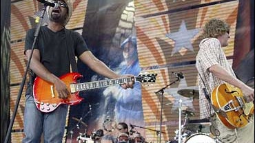 Hootie & the Blowfish perform during the Farm Aid concert at Germain Amphitheater in Columbus, Ohio, on Sept. 7, 2003. The group is again delaying the start of their summer tour as Rucker, left, recovers from a staph infection in his left knee. 