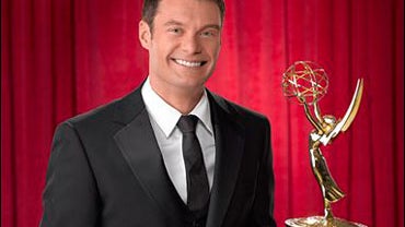 Ryan Seacrest holding an Emmy Award. He'll host the the 59th annual Primetime Emmy Awards 