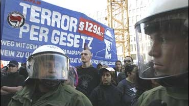 German riot police bock demonstrators protesting planned laws to increase online surveillance 
