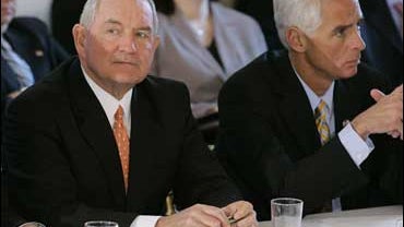 Georgia Gov. Sonny Perdue, left, and Florida Gov. Charlie Crist, right, listen as President Bush, not pictured, addresses the National Governors Association (NGA), Monday, Feb. 26, 2007, 