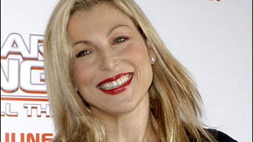 Tatum O'Neal headshot, actress, photo on black 