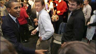 Democratic presidential hopeful, U.S. Sen Barack Obama, D-Il., reaches out to shake hands following an energy policy speech in Portsmouth, N.H., Monday, Oct. 8, 2007.(AP Photo/Jim Cole) 