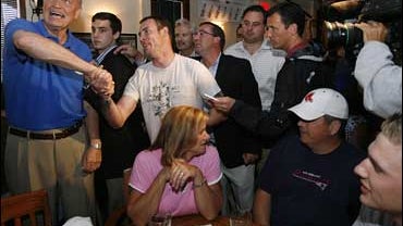 Republican presidential hopeful, former U.S. Sen., Fred Thompson of Tennessee shakes hands with a supporter as he watches a play from the Patriots vs. Jets football game during a campaign stop at P.J. O'Sullivan's in Manchester, N.H., Sept. 9, 2007. The d 