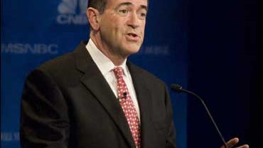 Former Arkansas governor and Republican presidential hopeful Mike Huckabee answers a question during the Republican Presidential Debate at the Ford Community & Performing Arts Center 09 October 2007 in Dearborn, Michigan. 