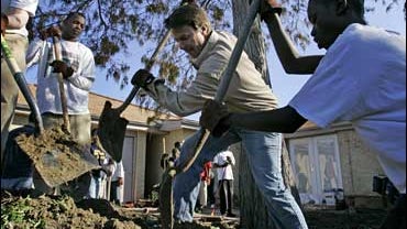 ** FILE ** John Edwards shovels with student volunteers as he works in the backyard of a house in an area affected by Hurricane Katrina in New Orleans in this Dec. 27, 2006 file photo. Edwards has been among the most aggressive of the Democratic president 