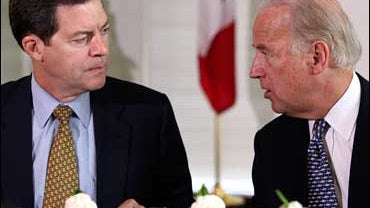 Republican presidential hopeful Sen. Sam Brownback, R-Kan., left, talks with Democratic presidential hopeful Sen. Joe Biden, D-Del., during a luncheon prior to a joint campaign event to outline their plan for Iraq, Friday, Oct. 12, 2007, in Des Moines, Io 