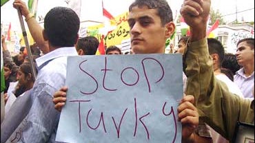thousands of Kurds pack the streets of Zakho, Iraq, to protest a threatened Turkish incursion 