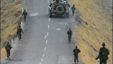 Turkish soldiers patrol a road in the province of Sirnak, on the Turkish-Iraqi border 