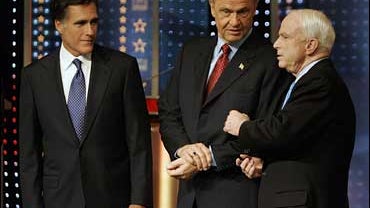 Republican presidential hopefuls, from left, former Massachusetts Gov. Mitt Romney, former Sen. Fred Thompson, R-Tenn., Sen. John McCain, R-Ariz., talk before a Republican presidential debate in Orlando, Fla., Sunday, Oct. 21, 2007. (AP Photo/John Raoux) 