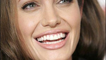 Actress Angelina Jolie poses on the press line at the International Women's Media Foundation Courage Awards 