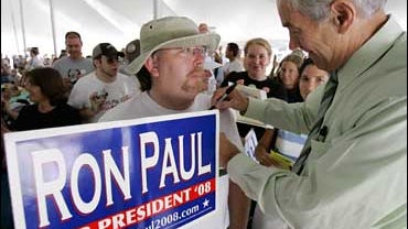  Republican presidential hopeful, Rep. Ron Paul, R-Texas, signs an autograph for Scott Gilbert, of Des Moines, Iowa, during the Iowa Straw Poll, in Ames, Iowa in this Aug. 11, 2007 file photo. Those who dismissed Rep. Ron Paul as a joke in the Republican  