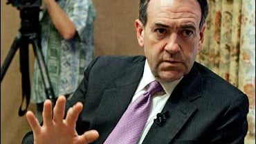 Republican Presidential hopeful, former Arkansas Governor, Mike Huckabee, gestures as he talks to the media before a private fundraiser Tuesday afternoon Nov. 20, 2007, in Tampa, Fla. (AP Photo/Chris O'Meara) 