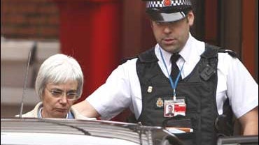 Anne Darwinleaves the police station at Manchester Airport 
