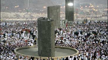 Muslim pilgrims perform the ritual "stoning of the devil" in Mina, Saudi Arabia, during the hajj 