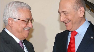 In this photo released by the Government Press Office, Israeli Prime Minister Ehud Olmert, right, and Palestinian President Mahmoud Abbas, left, meet in Jerusalem, Thursday, Dec. 27, 2007. 