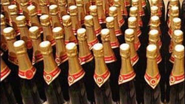 Champagne bottles line the shelves of a supermarket in the northern city of Bailleul, France, Feb. 15, 2012. 