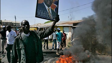 Supporters of opposition leader Raila Odinga burn tyres at a barricade in Kisumu, western  Kenya, Wednesday, Jan. 9, 2008. 