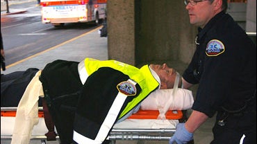 An injured passenger is transported to a hospital at Calgary International Airport 
