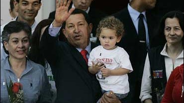 Venezuela's President Hugo Chavez with released hostages 