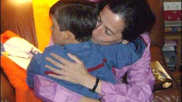 Clara Rojas embracing her son 
