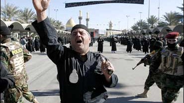 Devout believers flagellate themselves as sign of grief for Imam Hussein in the Shiite holy city of Karbala 