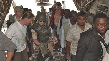 foreigners are evacuated by the French army from N'Djamena in a C130 plane, Chad 
