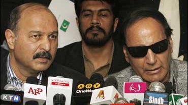 Pakistan ousted ruling party chief, Chaudhry Shujaat Hussain, right 
