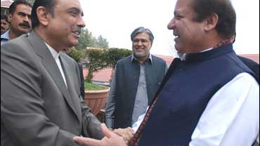 Pakistan Peoples Party's co-chairman Asif Ali Zardari shakes hands with Pakistan's Muslim League-N party chief Nawaz Sharif 