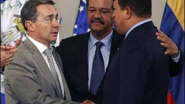 Colombia's President Alvaro Uribe, left, shakes hands with Venezuela's President Hugo Chavez 