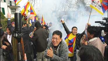 Indian police detain a Tibetan protester outside the Chinese Embassy in New Delhi 