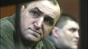 Former police officers Mykola Protasov, left, and Valery Kostenko during their trial in Kiev, Jan. 9, 2006. 