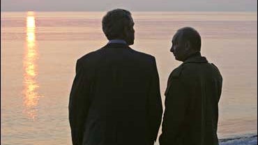 President George Bush walks with Russian President Vladimir Putin at his summer residence in Sochi, Russia 
