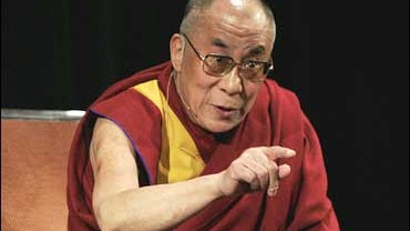 The Dalai Lama answers a question at a news conference 