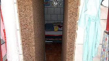 A photo taken by a forensic team and released by the Austrian police with permission of Austria's prosecution office on Monday, April 28, 2008 shows a view into a hidden room in a house in Amstetten, Austria, in which a woman is believed to have been held 