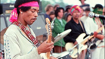 Jimi Hendrix performing at Woodstock Music Fair 