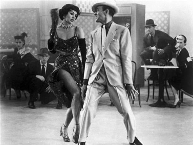 . In this undated file photo, Fred Astaire, right, and Cyd Charisse dance in the 1953 film "The Band Wagon". Charisse, the long-legged Texas beauty who danced with the Ballet Russe as a teenager and starred in MGM musicals with Fred Astaire and Gene Kelly 