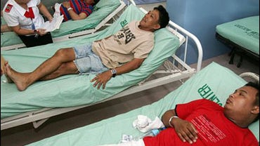 Survivors from the ill-fated ship MV Princess of the Stars, recuperate at Quezon Memorial Hospital in Lucena city, 170 kilometers south of Manila, where they were brought Monday June 23, 2008 after drifting in the sea for 48 hours. 